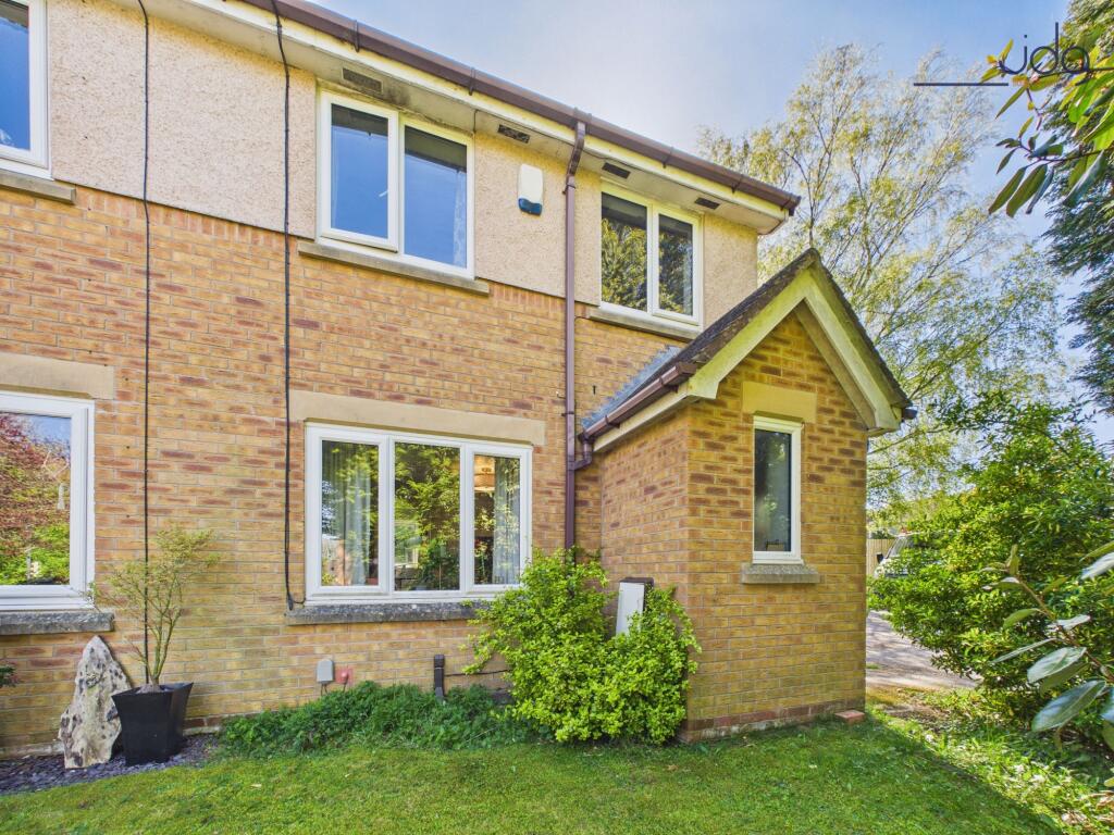 Main image of property: Larchwood, Hala | A bright two-bedroom home with dedicated parking and more garden than expected.