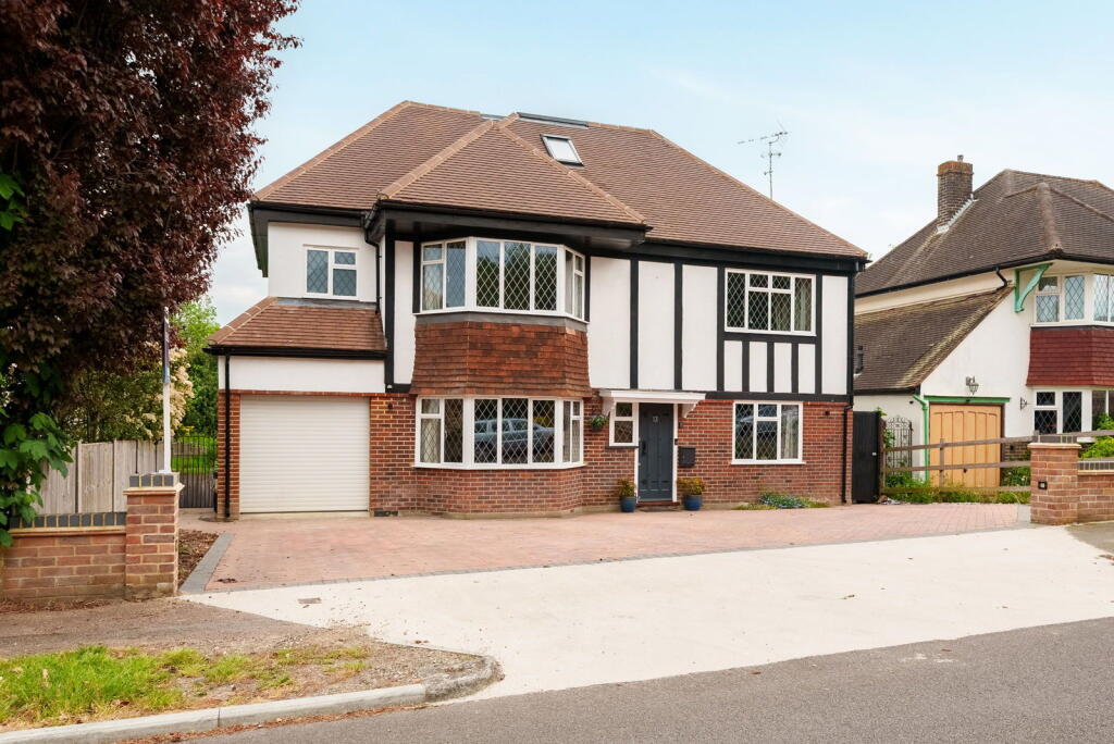 Main image of property: Walkfield Drive, Epsom, KT18 5UF