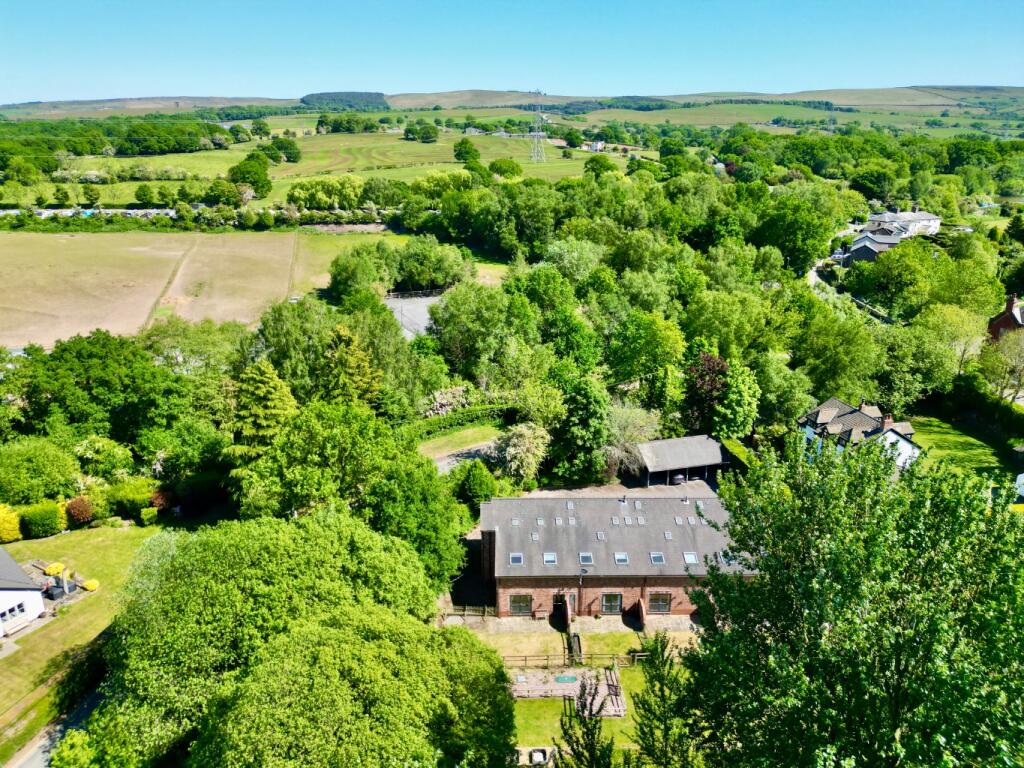 Main image of property: Woodhouse Farm Barns, Anson Road, Poynton, Stockport, Cheshire, SK12 1TD