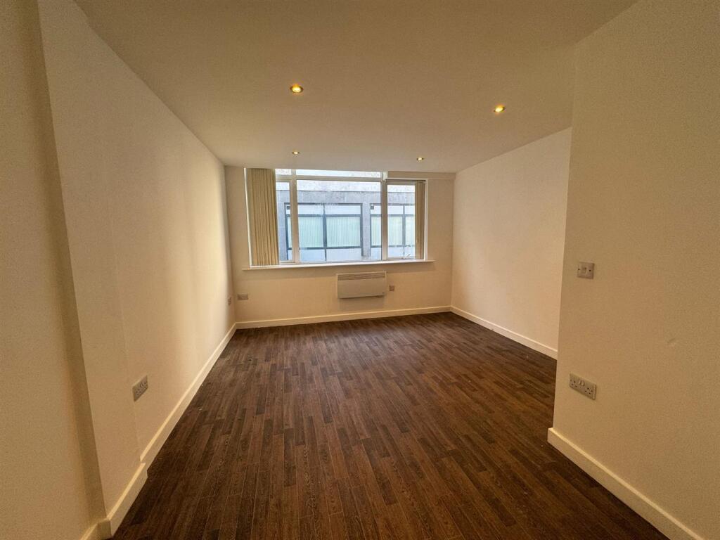 Main image of property: ONE BEDROOM APARTMENT WITH PARKING