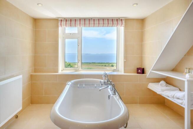 en-suite bathroom with rol top bath and view!