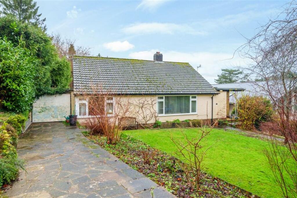 Main image of property: 4 bedroom Detached Chalet Bungalow in Caterham Valley