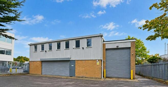 Industrial Warehouse Under Blue Skies.jpg