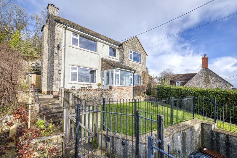 Main image of property: Elevated detached village home in West Horrington enjoying open views across Wells