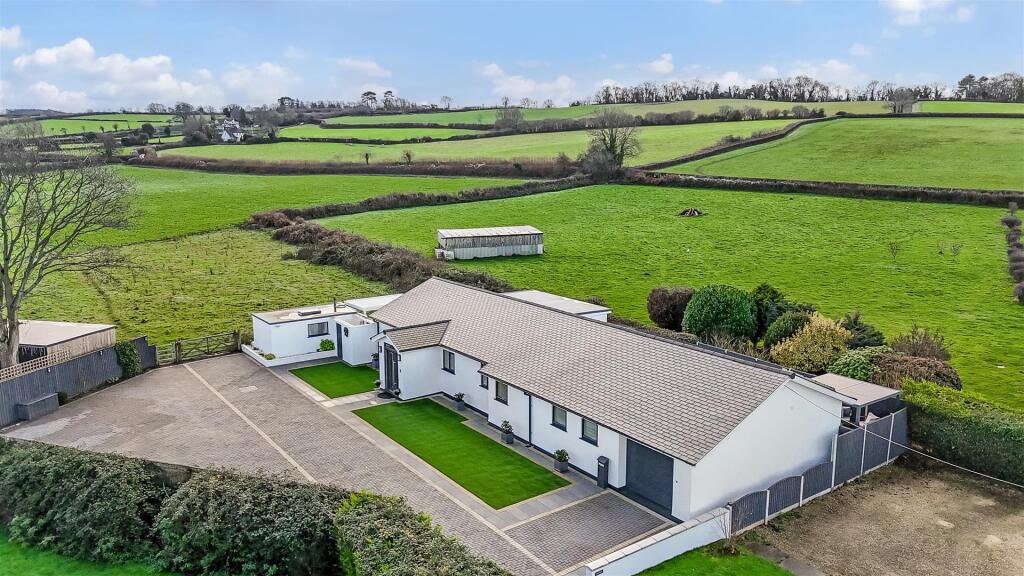 Main image of property: Stunning detached (2,000 sq ft) high spec bungalow in an idyllic rural setting with stunning open views