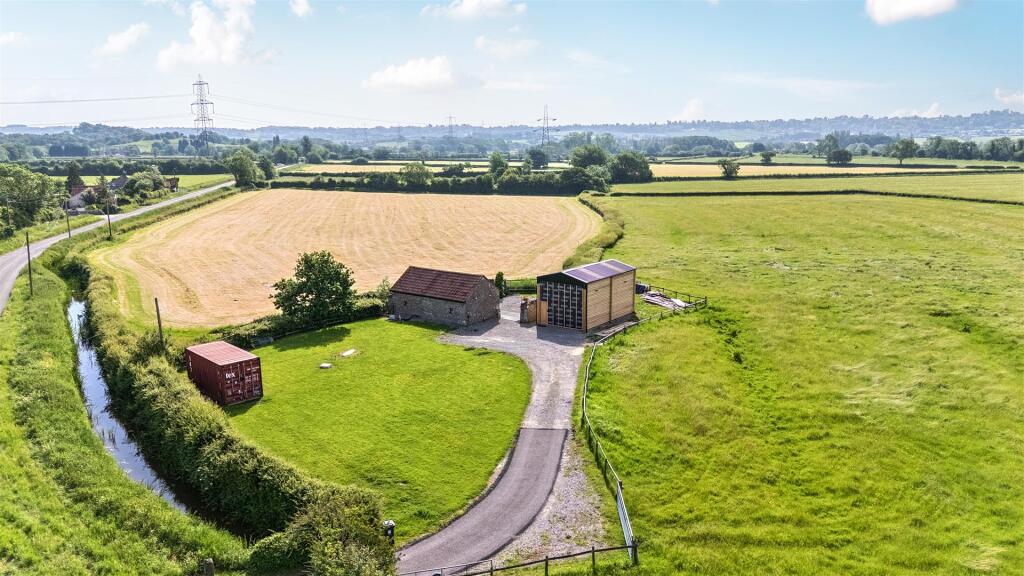 Main image of property: Detached one bedroom barn conversion with further detached barn and circa 11 acres of land in Pilning