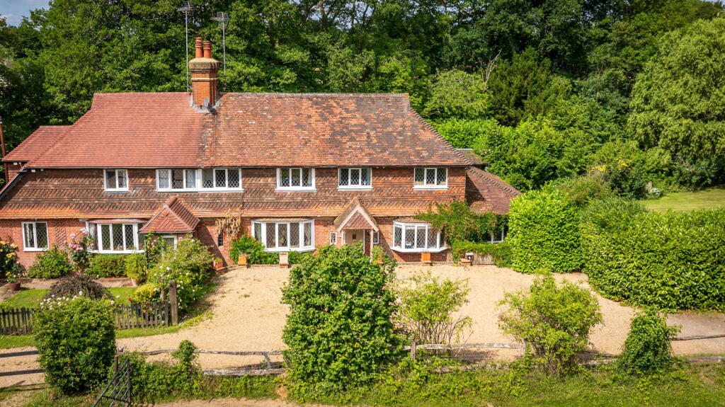 Main image of property: Woodlands Cottage, Ockley Road, Ewhurst, GU6 7QL