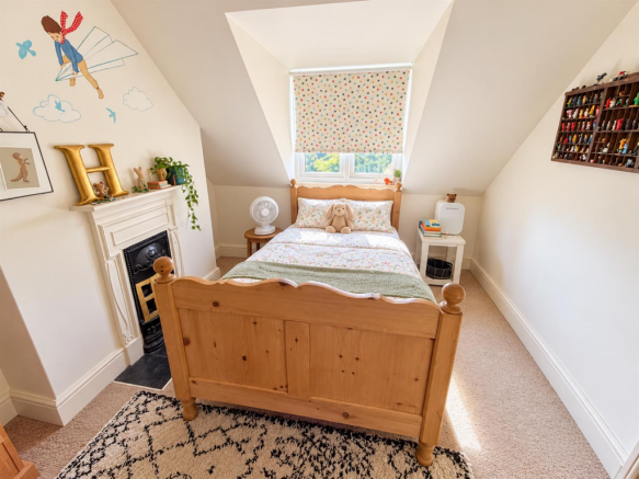 Cosy Attic Bedroom with Starry Window Blind.png