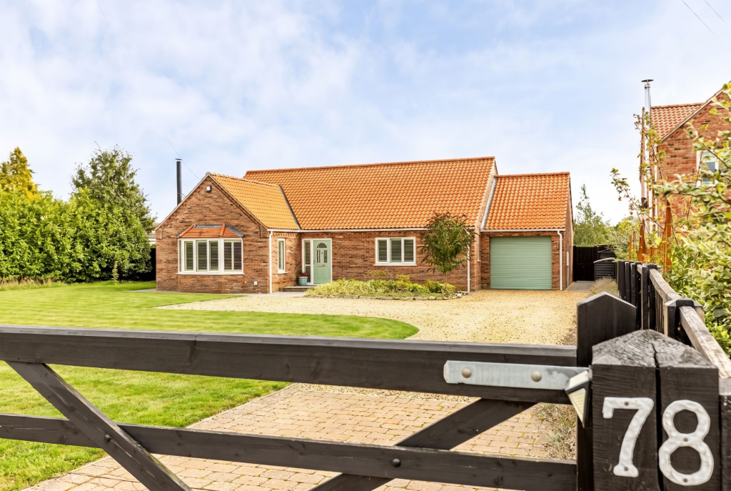 Main image of property: Detached Bungalow in East Winch with Ample Gated Parking