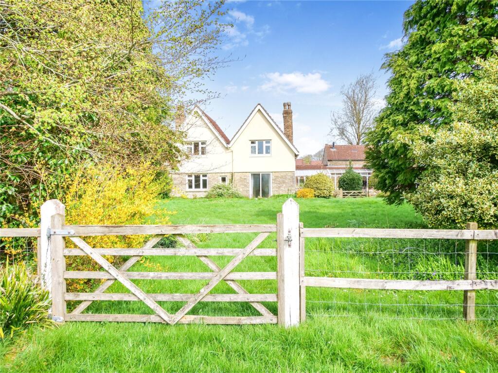 Main image of property: Four bedroom house with adjoining barns, outbuildings & two paddocks (3.92 acres.)