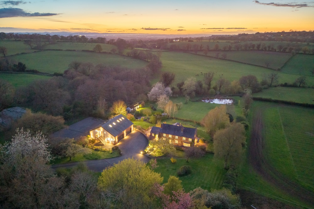 Main image of property: Tarporley home with over 6,000 square feet of space and 4 acres