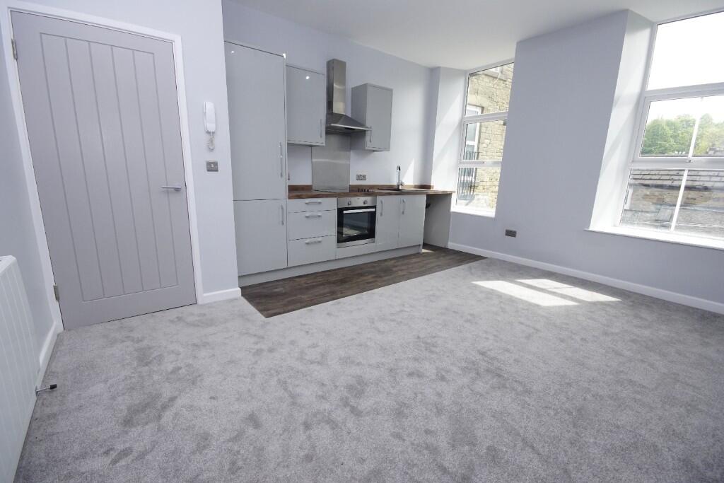 Main image of property: Flat at High St West, Glossop, SK13 8AZ **VIEW NOW!**