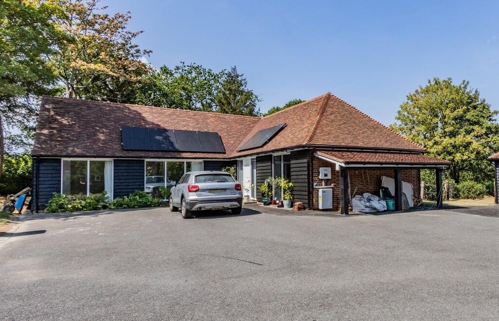 Main image of property: Chalet Style Property on No-Through Road In Hawkhurst
