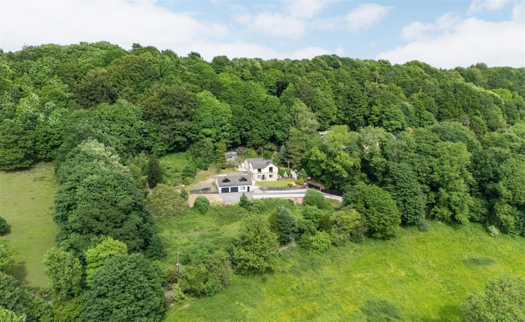 Main image of property: Wood Nook, Sutcliffe Wood Lane, Halifax, West Yorkshire, HX3 8PS