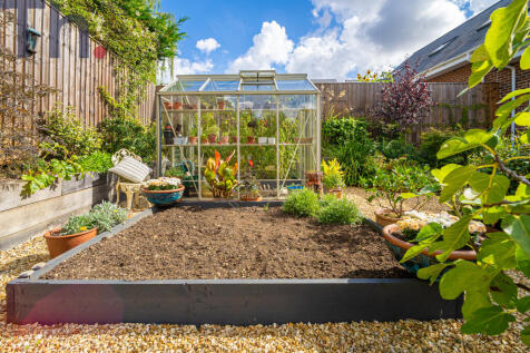 Vegetable Garden Area with Greenhouse