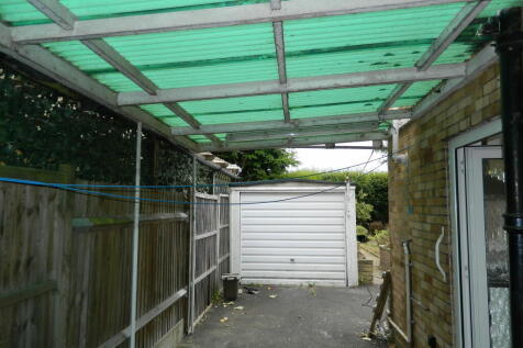 carport leading to garage