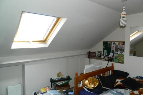 boarded loft space with &#39;VELUX&#39; window