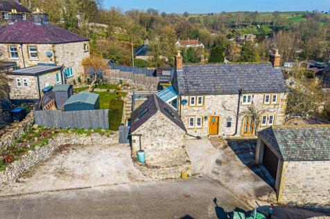 Aerial overview of house, garden and parking