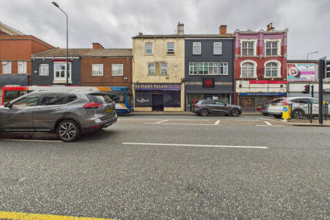 Ground floor retail space with three flats above 