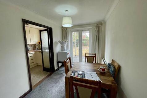 Dining area with door to patio and garden