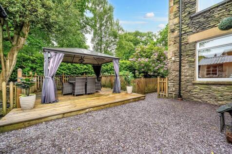 Rear garden and decked area over beck