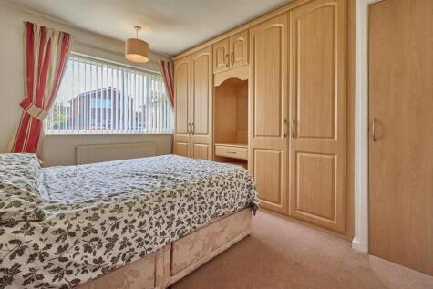 BEDROOM ONE TO FRONT