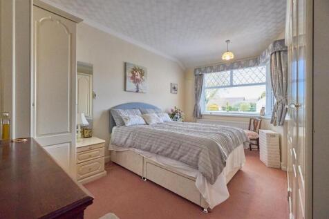 BEDROOM ONE TO FRONT