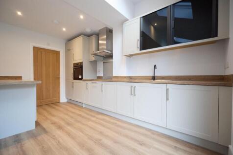 Open plan kitchen diner to rear