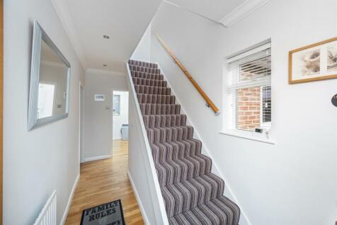 Stairs rising to First Floor