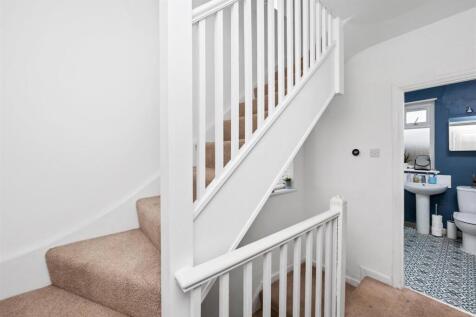 Stairs rising to Second Floor