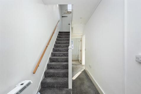 Stairs rising to First Floor