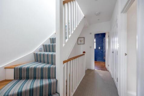 Stairs rising to Second Floor