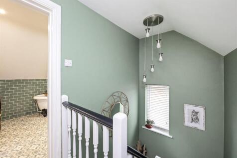 Stairs rising to First Floor