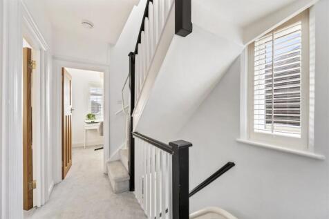 Stairs rising to Second Floor