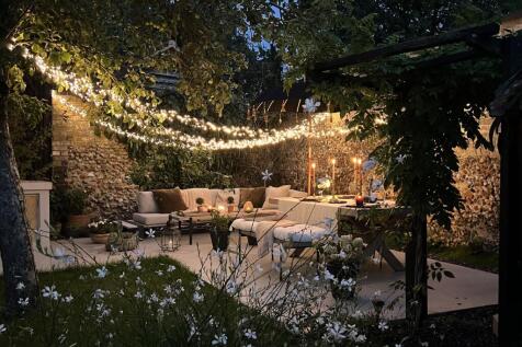 TheOldForge-WalledGardenAtNight.jpg