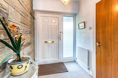 ENTRANCE HALLWAY AND UTILITY ROOM