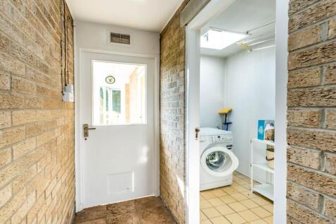 ENTRANCE HALLWAY AND UTILITY ROOM