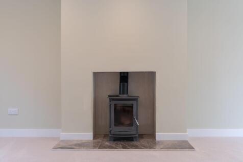 Light and spacious lounge with log burner