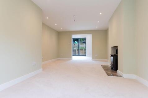 Light and spacious lounge with log burner