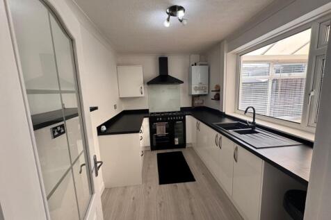 SITTING ROOM KITCHEN AND CONSERVATORY