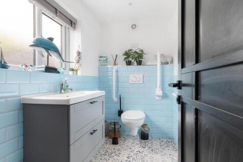 DOWNSTAIRS SHOWER ROOM AND W/CS