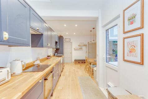 DINER OPENING TO EXTENDED FITTED KITCHEN