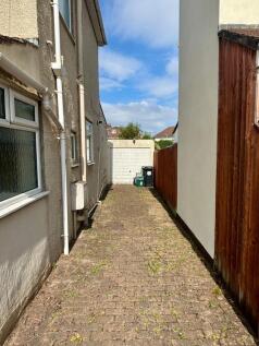 Narrow Driveway Leading To Garage