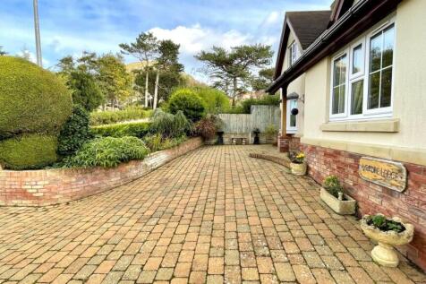 GOOD SIZED BLOCK PAVED PARKING AREA