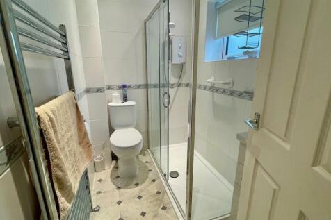 RE-FITTED TILED 3-PIECE SHOWER ROOM