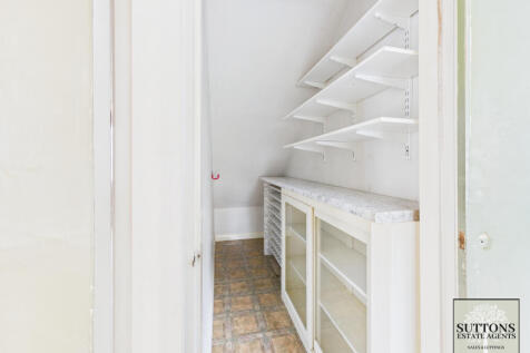 Pantry under stairs