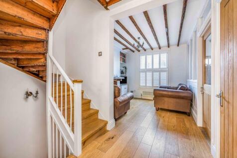 Stairs to upper floors and down to st...