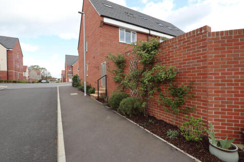 Side of property and garden borders