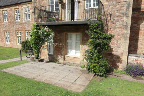 Patio and balcony above