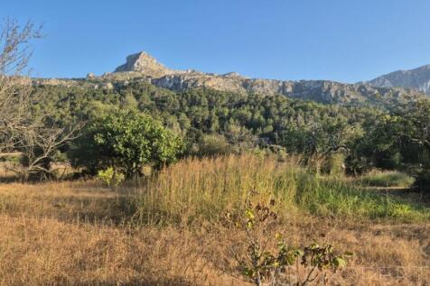 Land with small house 